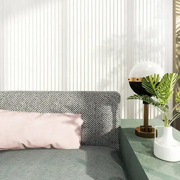 Vertical blinds behind a sofa in a sunlit room